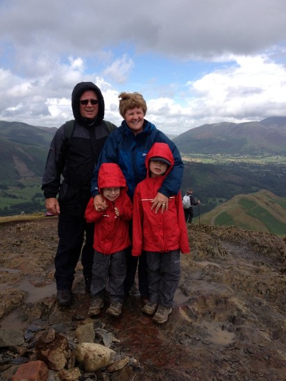 Nanny, Grandad and the two boys at the summit as a rain shower comes in!!