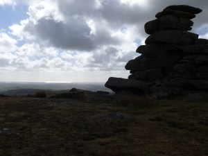 Granite stacks on Great Staple Tor with Plymouth Sound in the distance