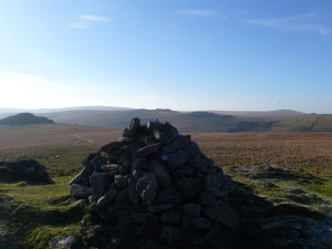 Cairn on Higher White Tor with Longaford Tor left, Beardown Tors over the cairn and Great Mis Tor right.