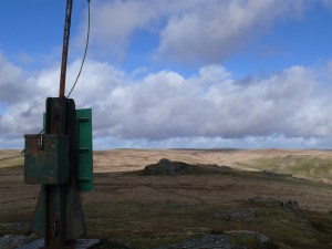 Millitary marker post with one of the Beardown Tors
