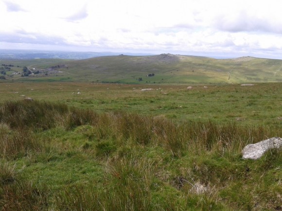 Mid and Great Staple tors with Roos Tor to the right in the sun