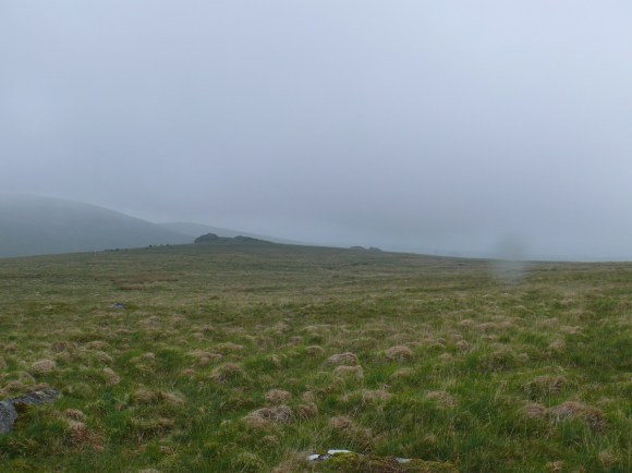 Looking down on Black Tor as we come out of the cloud