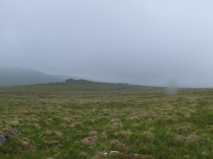 Looking down on Black Tor as we come out of the cloud