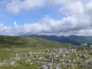 Heading to Thunacar Knott with the pointy Sergeant Man and a dark looking Helvellyn range behind.