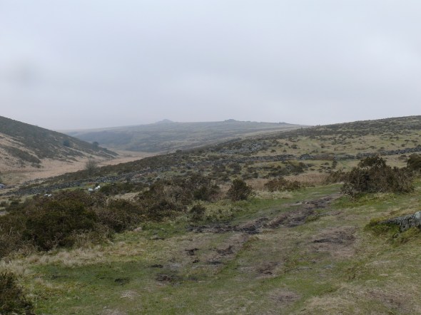 Climbing the side of Crocken Tor and looking at a rather gloomy Longaford Tor