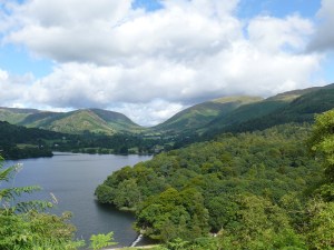 Along the length of Grasmere with Helm Crag the fell in the sun