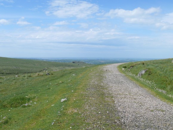 Looking back along the old railway path with Ingra Tor in the middle distance and Cornwall beyond