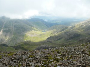 Sunshine lights up Styhead from the path up to Scafell Pike summit
