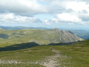 Heading for Esk Hause with the Langdale Pikes catching the sun.