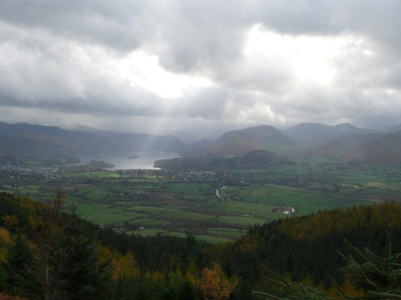 That doesn't look good, as sunlight pierces the clouds on Derwent Water